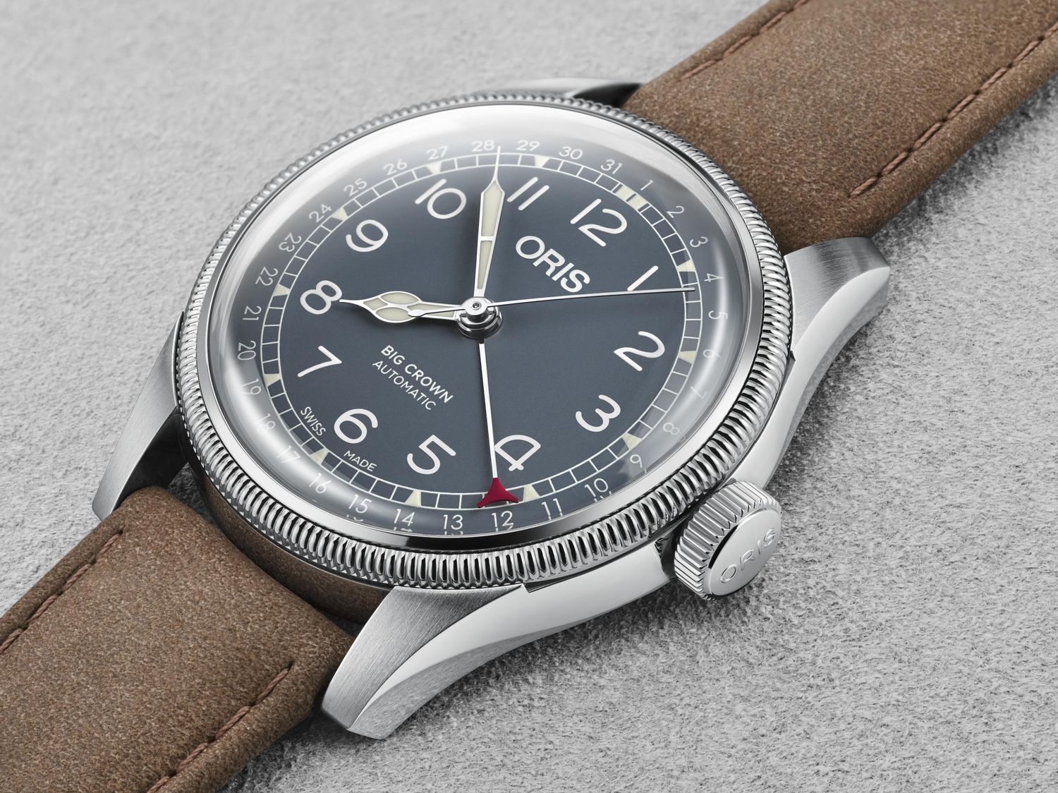 Oris Big Crown Pointer Date, Ref. 0175477414065-0752063 with brown leather strap and dark blue dial on a gray background