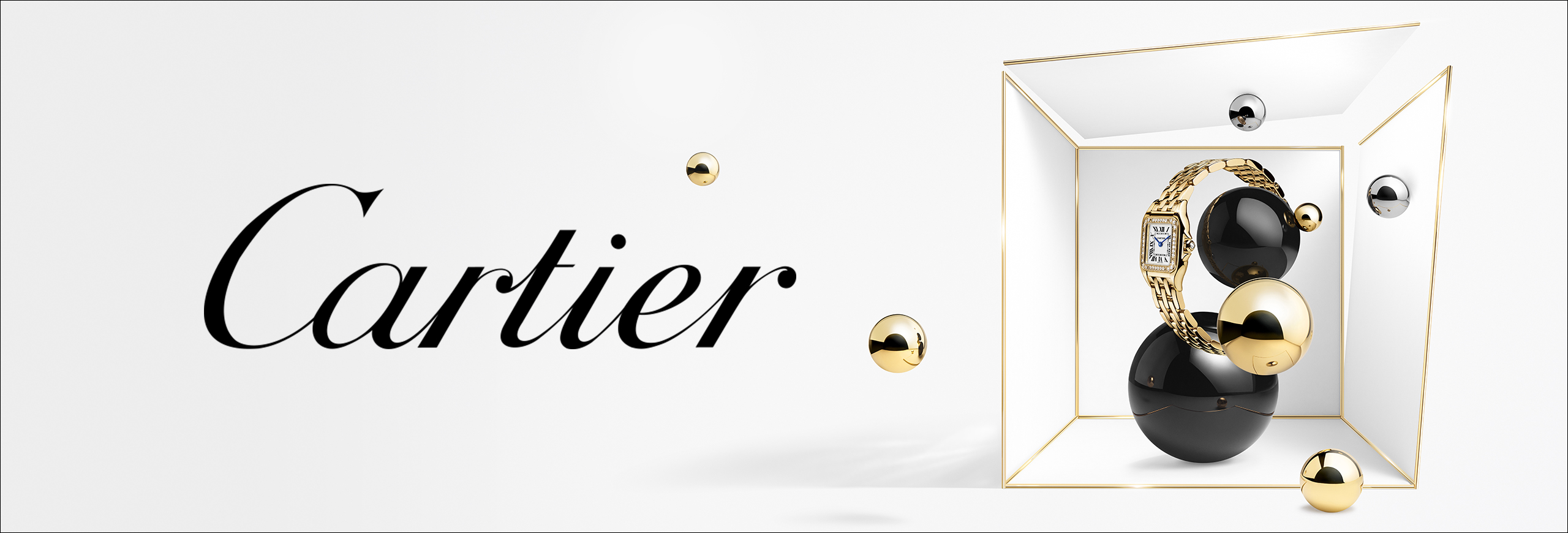 Panthère de Cartier en or avec bracelet à maillons dans une boîte blanche avec des sphères noires et dorées, à côté du logo Cartier.