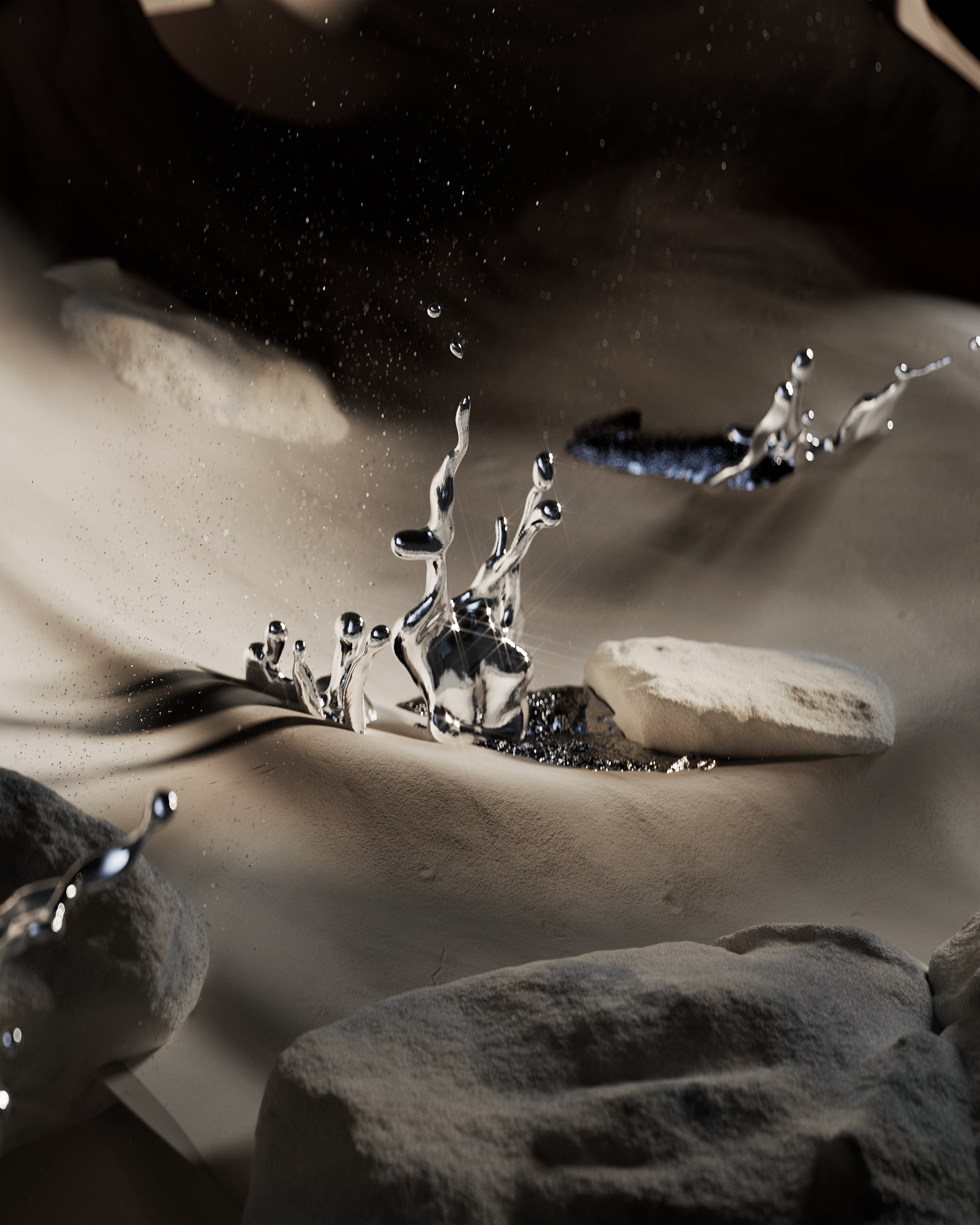 Splashes of liquid silver on a sandy surface with scattered rocks.