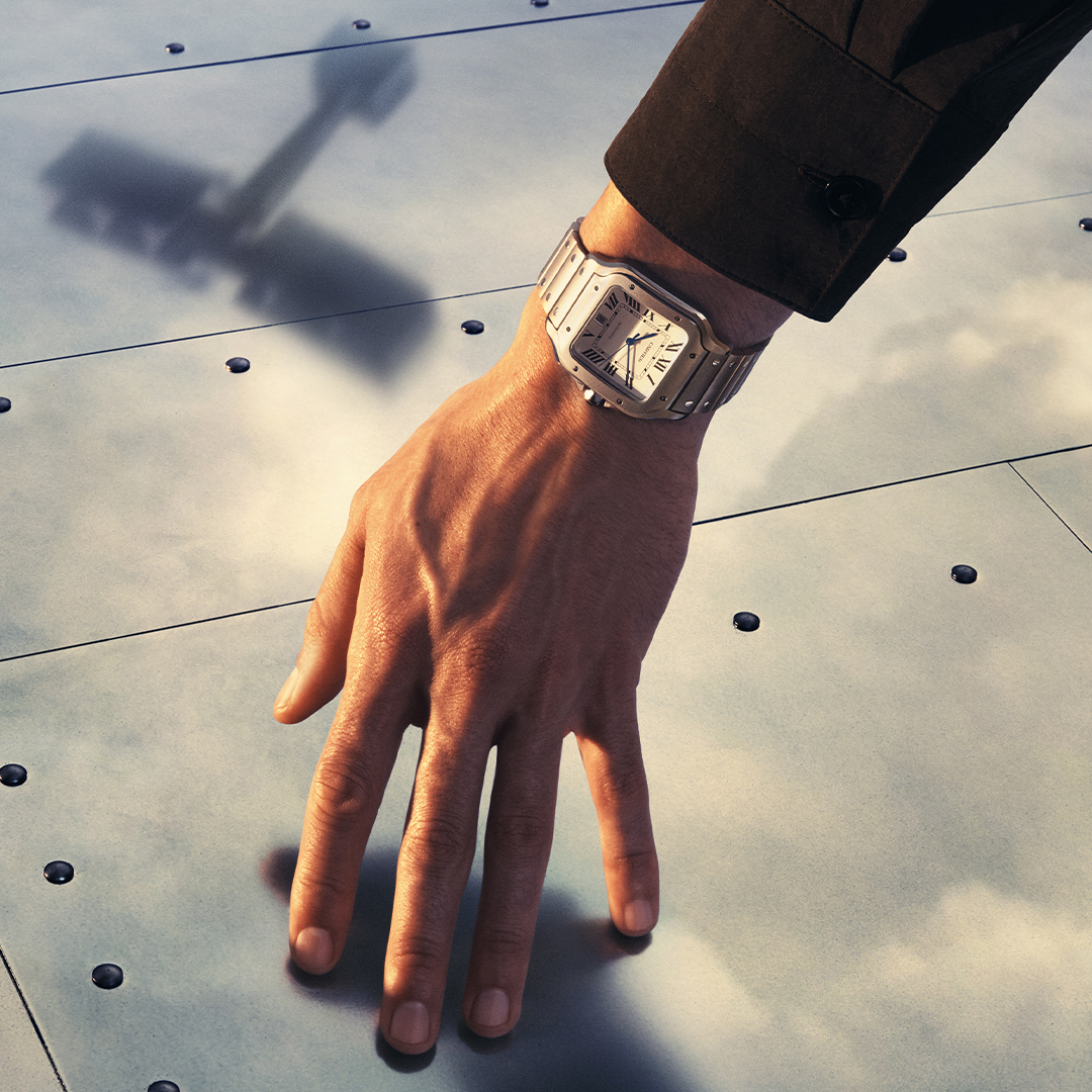 Close-up video of the Cartier Santos watch showcasing its iconic design details in motion.