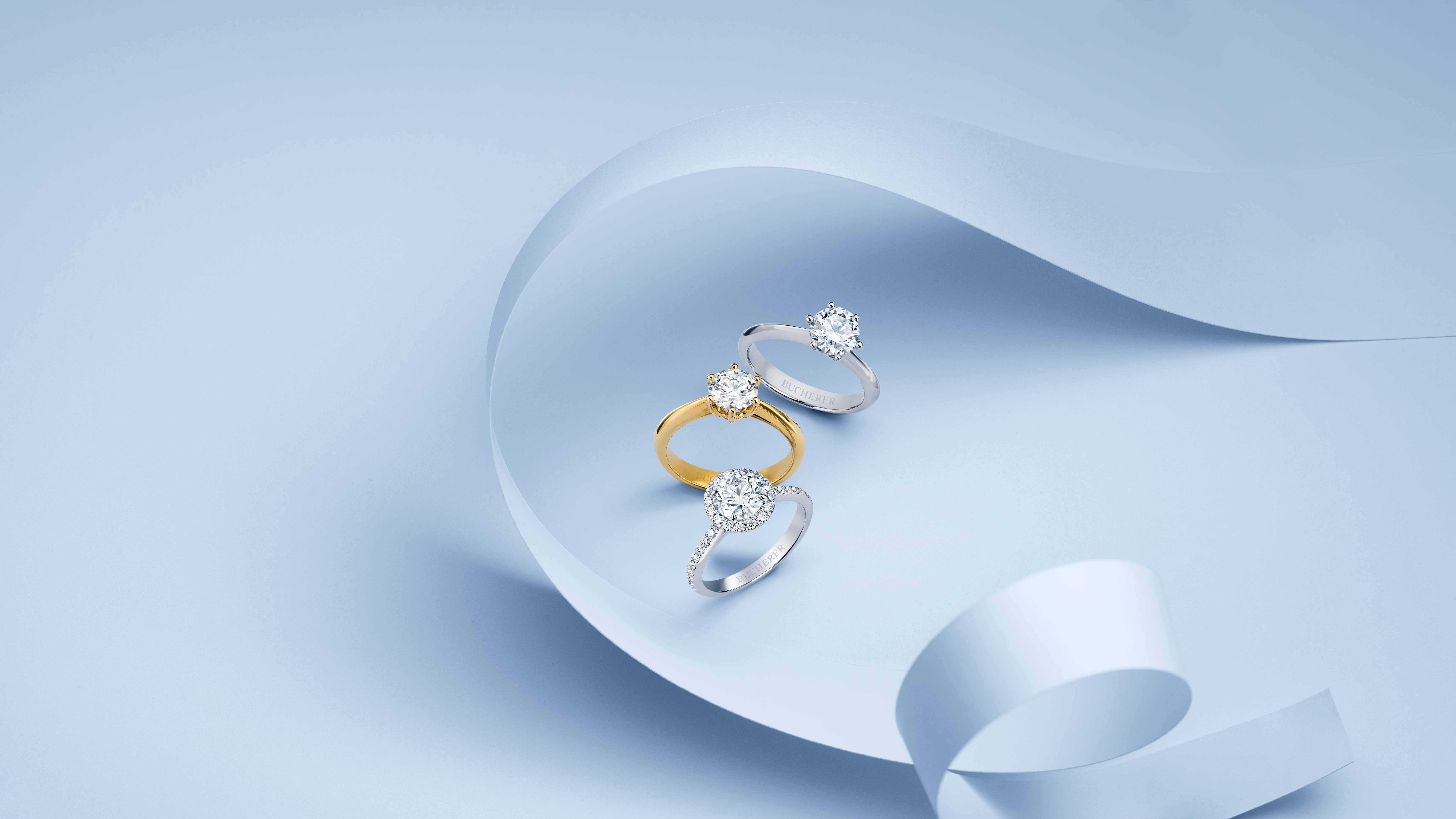 Solitaire Rings on light blue background