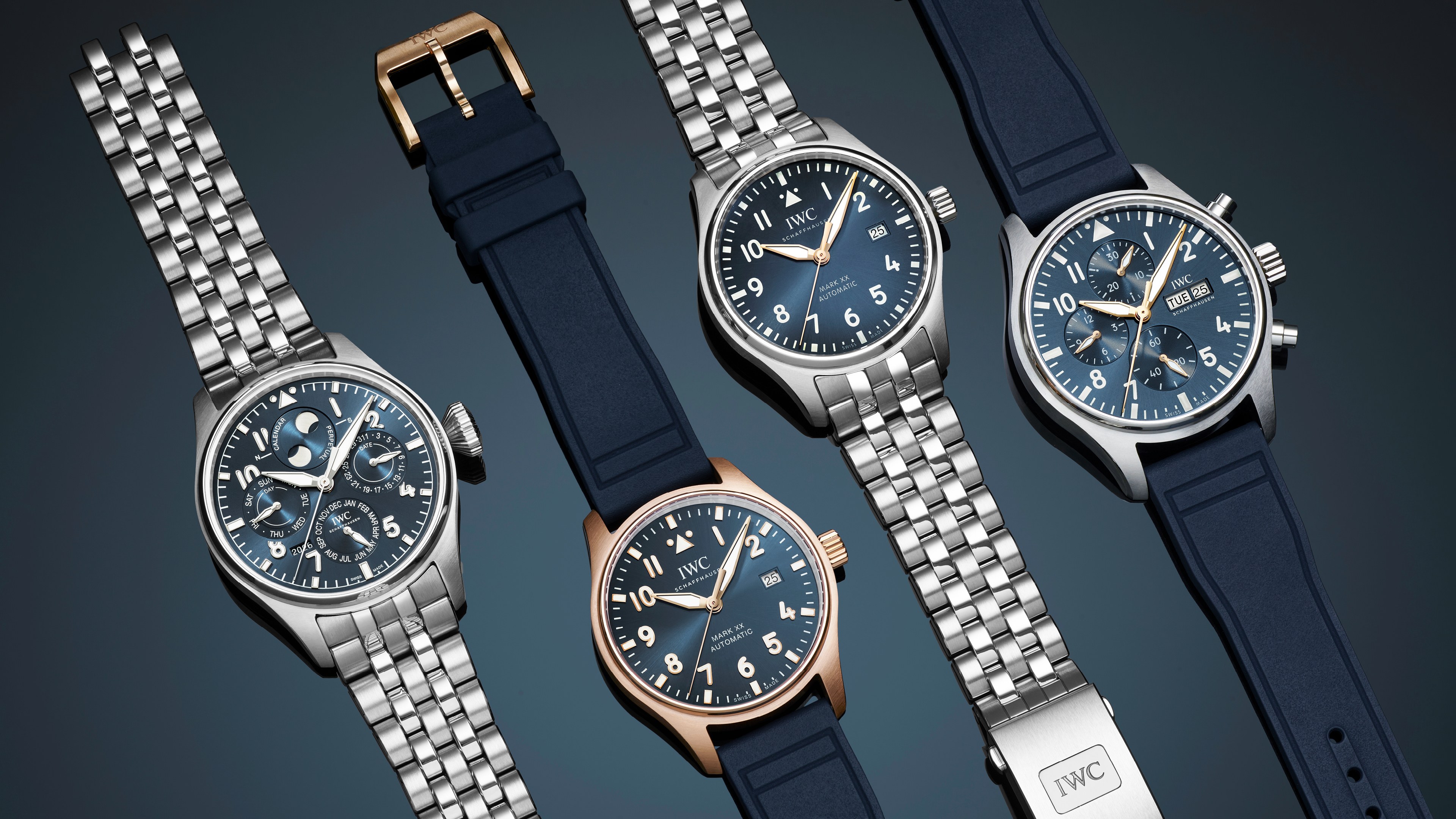 Four IWC Schaffhausen watches with blue dials and various metal and rubber straps.