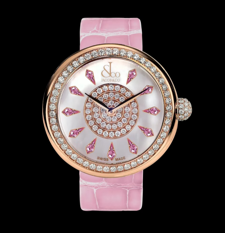 Rose gold watch with a mother-of-pearl face, diamond bezel, pink sapphire hour markers, and a pink alligator strap.