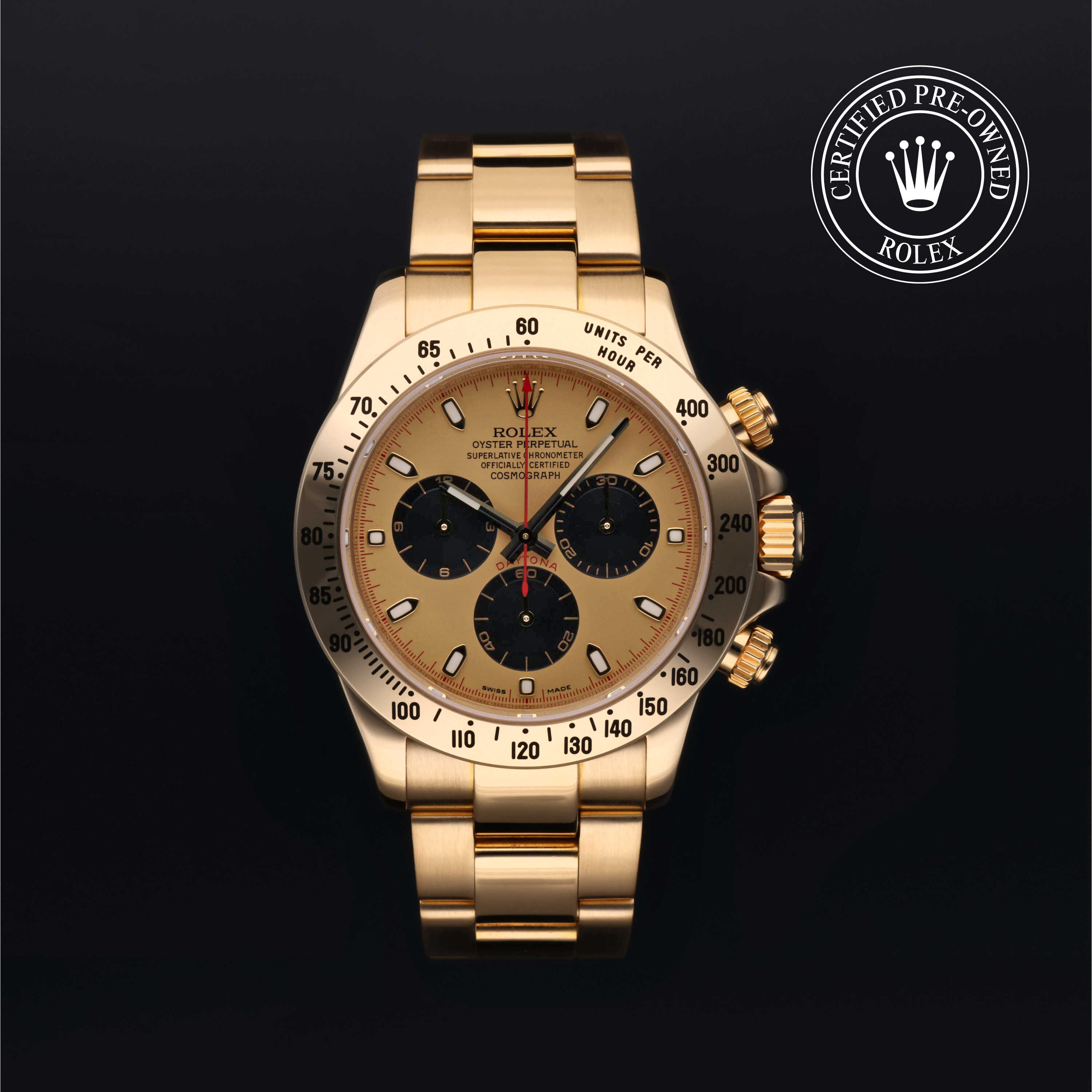 A gold Rolex Daytona chronograph watch with a gold dial and black sub-dials, with a "Certified Pre-Owned Rolex" seal.