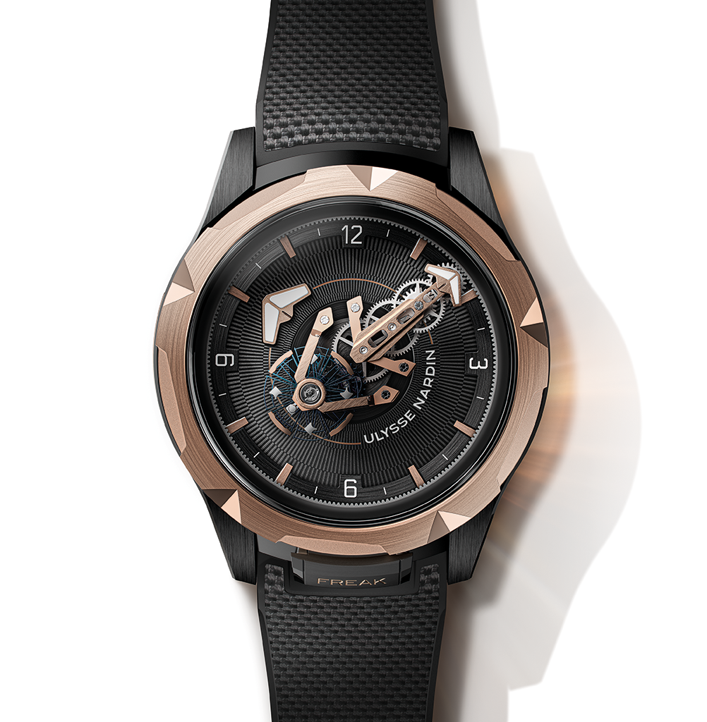 A black and rose gold Ulysse Nardin Freak watch with an exposed mechanical movement.