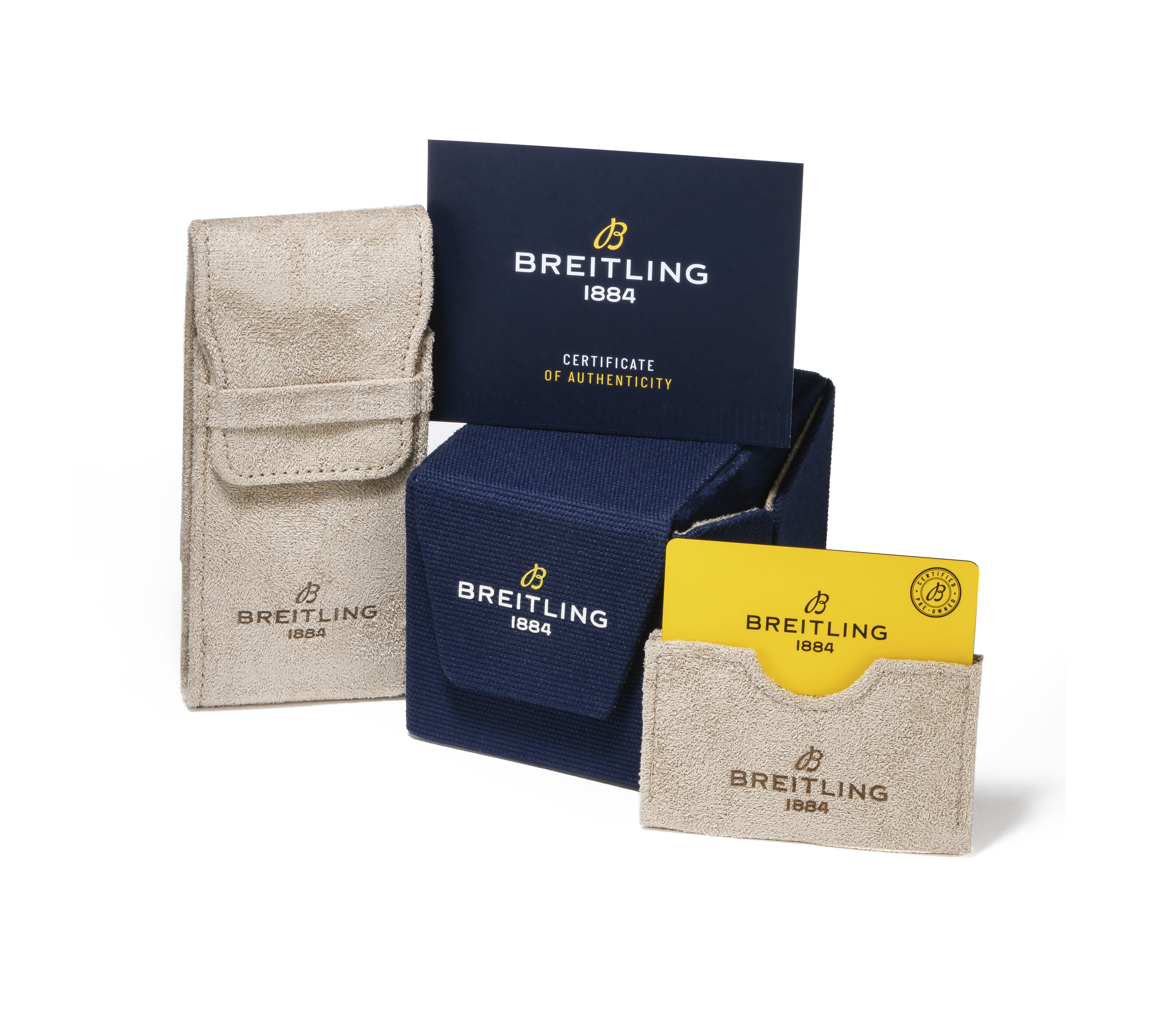 Breitling watch accessories including a beige pouch, a blue box with a certificate, and a yellow card in a beige holder.