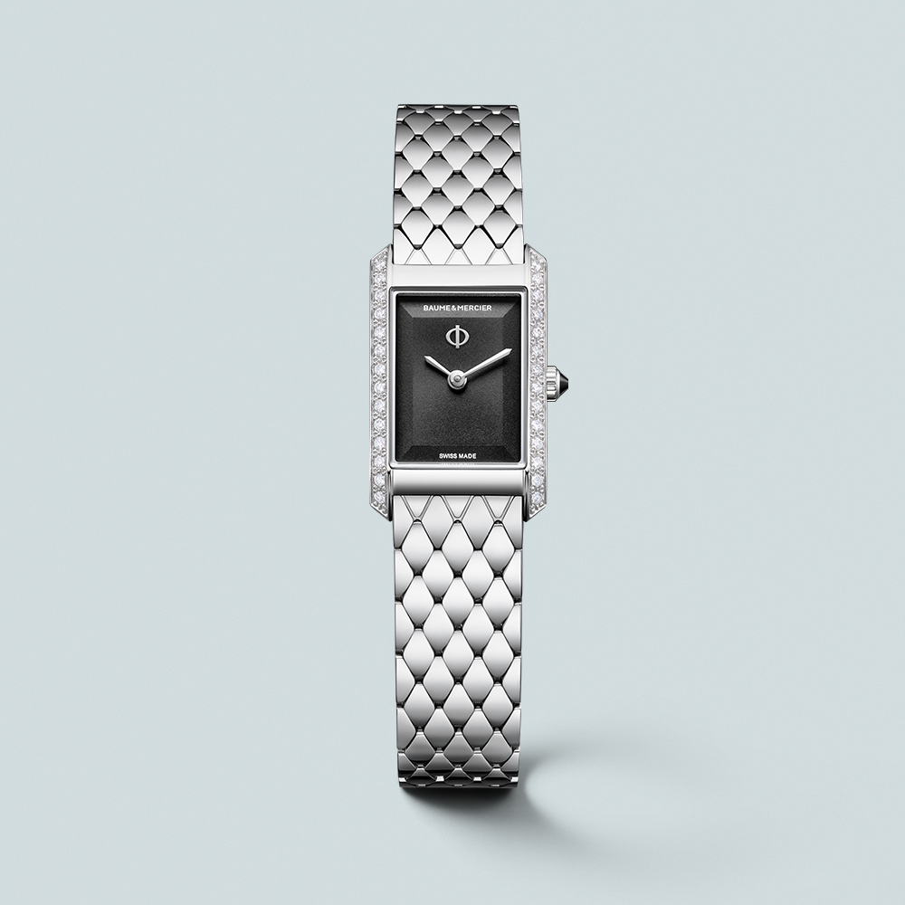 Silver rectangular watch with a black face, diamond-encrusted bezel, and a textured metal band.