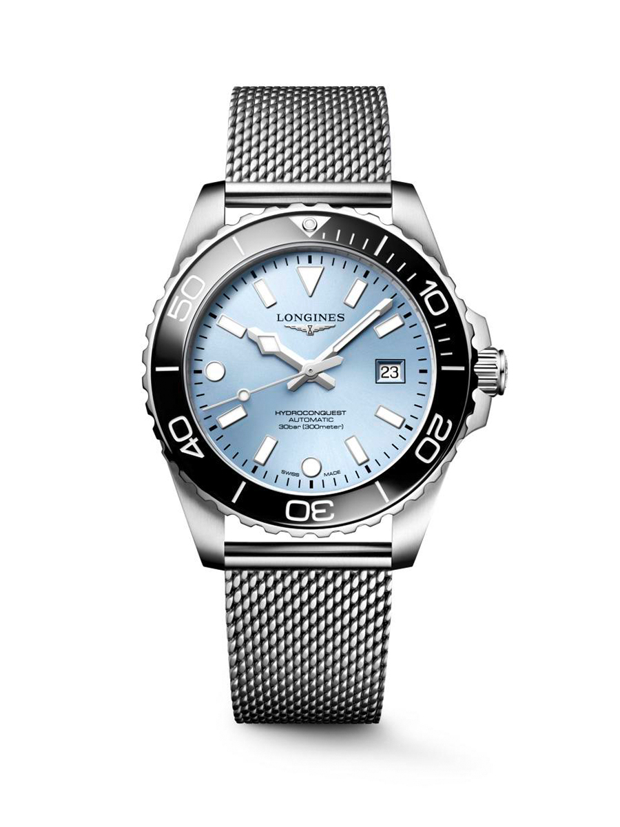 A Longines HydroConquest automatic watch with a light blue dial, black bezel, and a mesh metal strap.
