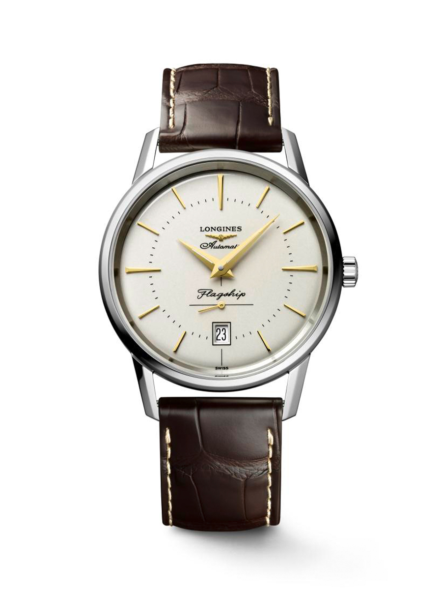 A Longines Flagship automatic watch with a white dial, gold hands and markers, and a brown leather strap.