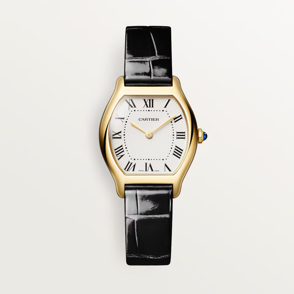 Gold Cartier watch with a white face, black Roman numerals, and a black alligator leather strap.