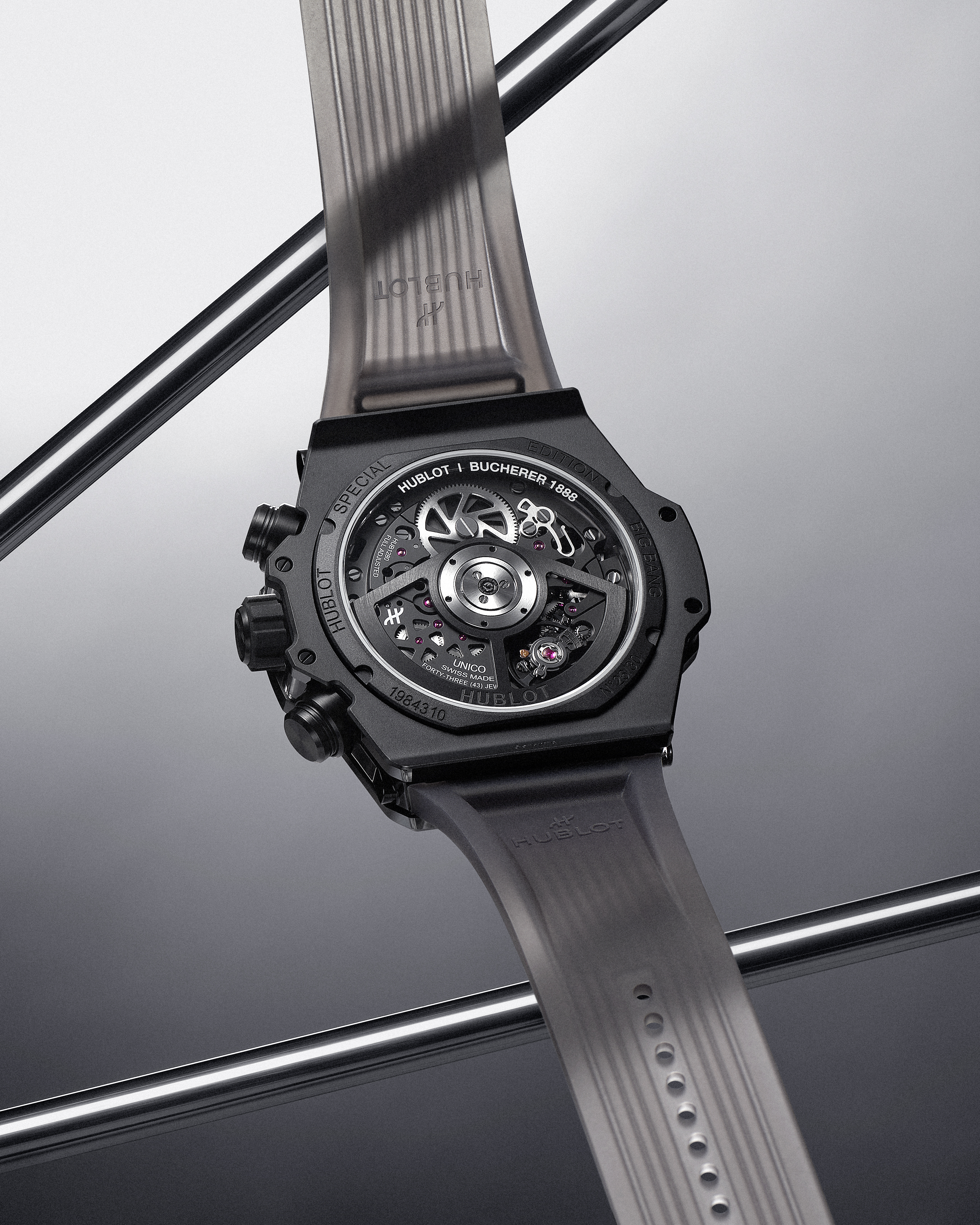 Back view of a black Hublot Big Bang Unico watch with a transparent strap, revealing its intricate mechanical movement.