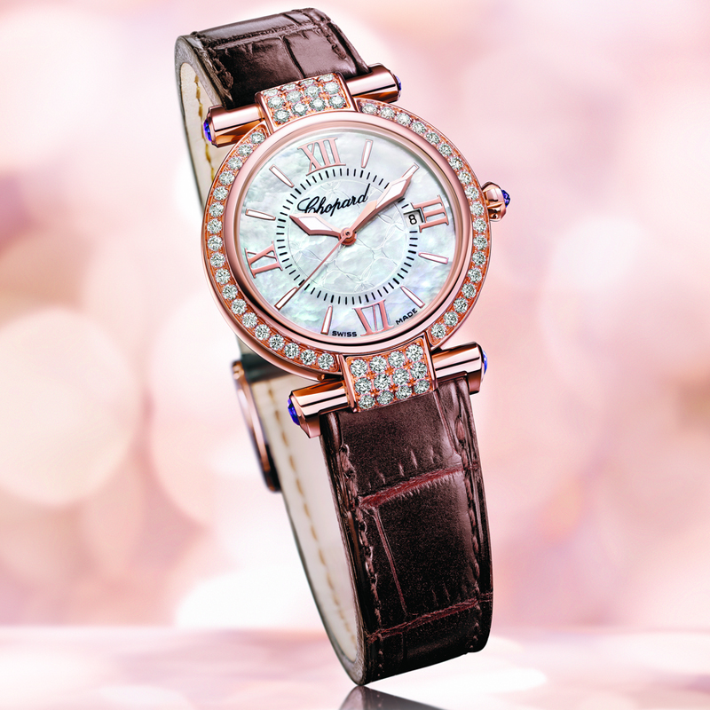 Chopard Imperiale watch with a rose gold case, diamond-set bezel, mother-of-pearl dial, and brown alligator strap.