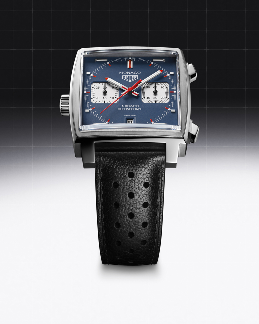 A square silver watch with a blue face and black perforated leather strap.