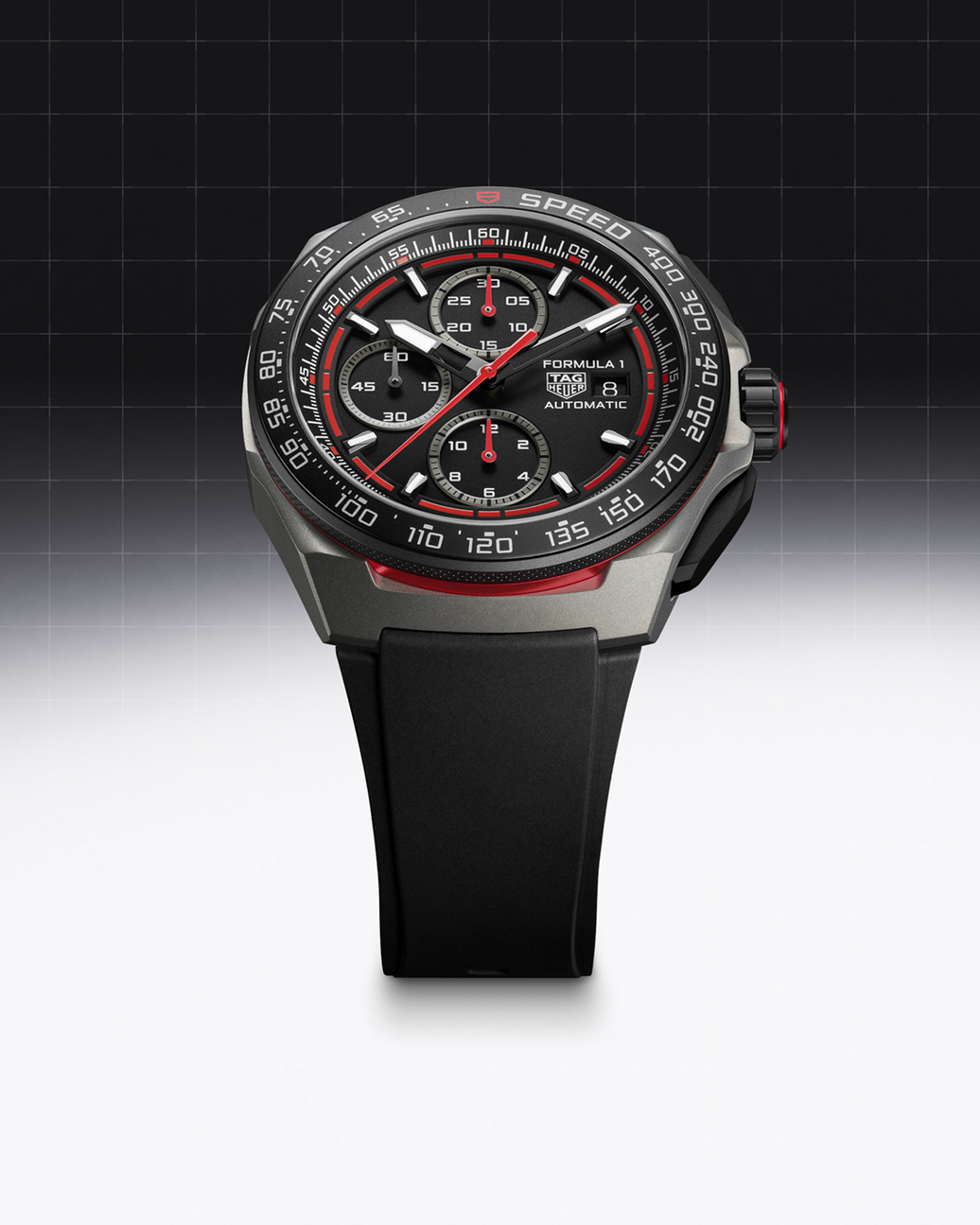 A black and red TAG Heuer Formula 1 automatic chronograph watch with a black rubber strap.